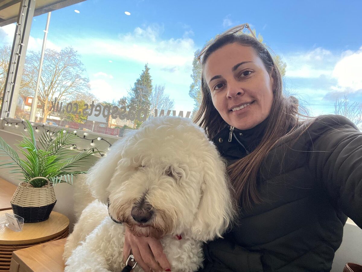 Priscila with one of the dogs she cares for